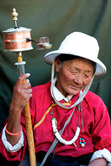 "Spinning a prayer wheel" Jorkand, Lhasa, Tibet